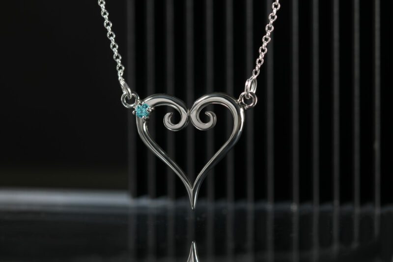 Sterling silver pendant in the shape of a heart with a set aquamarine.