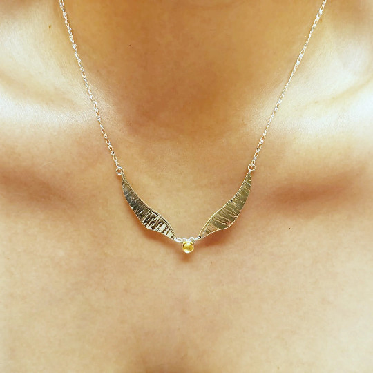 Golden Wing necklace handmade in sterling silver.